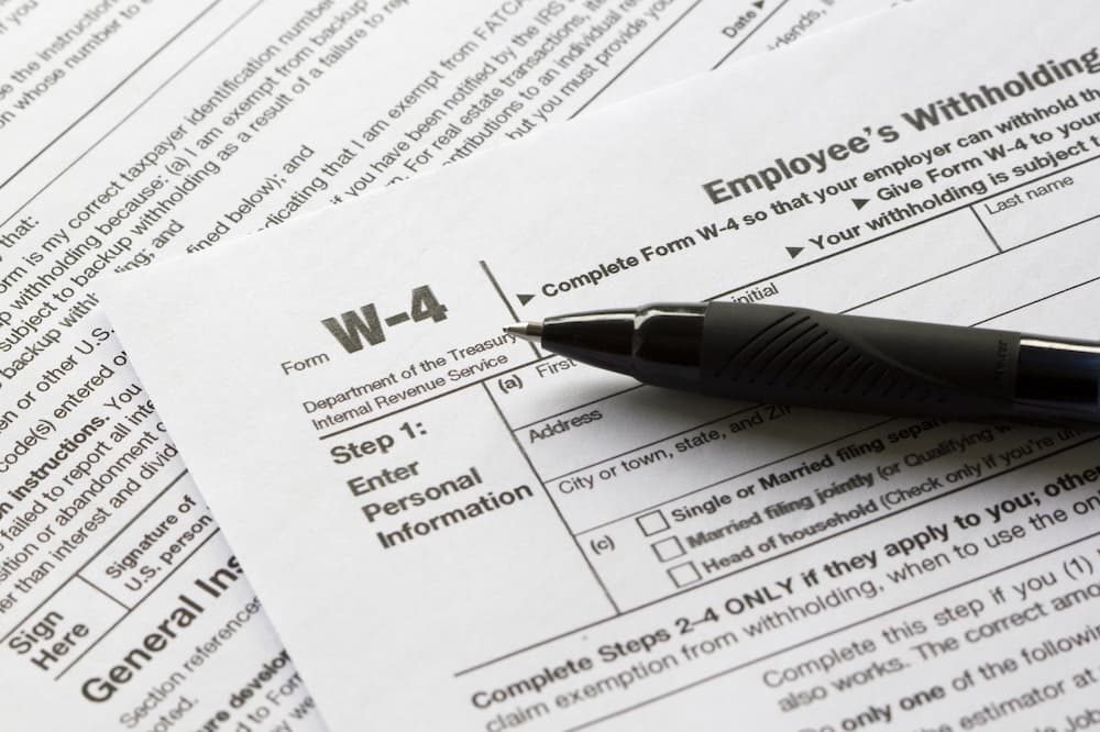 Close-up of Form W-4 document with pen (1).jpg