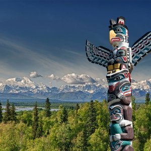 Totem pole with Mountains in BC